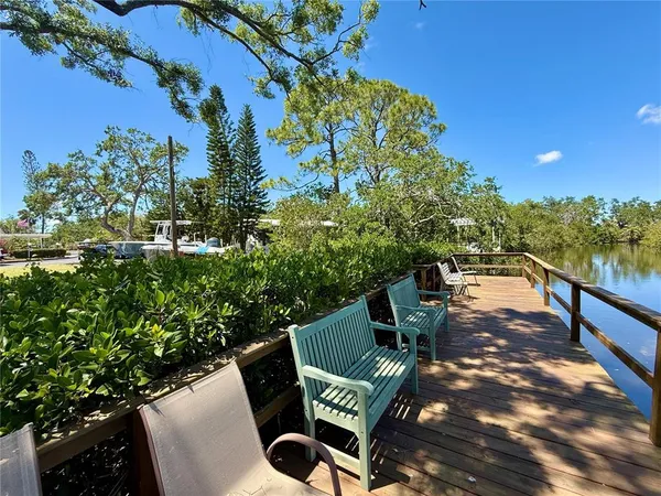 a view of a street with palm trees