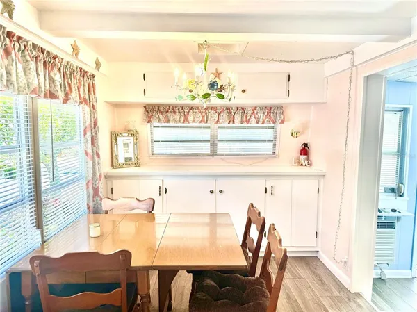 a view of a dining room with furniture window and outside view