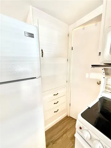 a bathroom with a shower and a sink