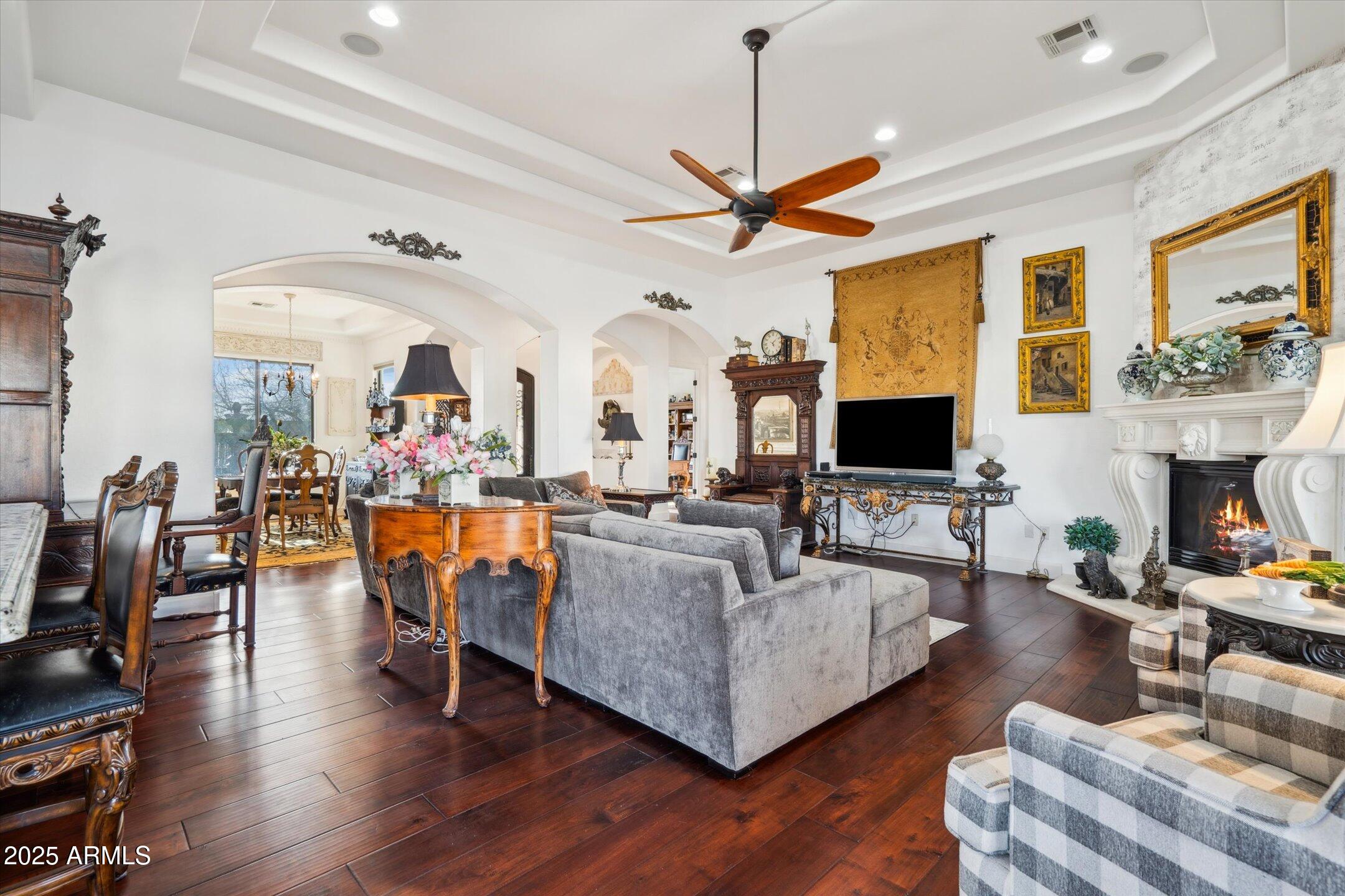 619 North Sun Road Apache Junction, AZ 85119 - Photo 13 of 72 a living room with fireplace furniture and a flat screen tv