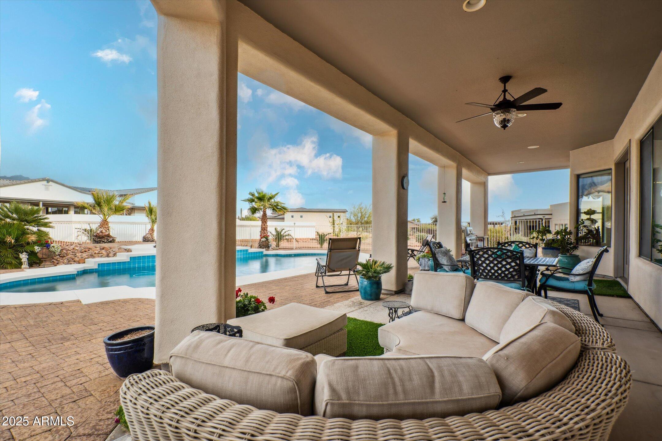 619 North Sun Road Apache Junction, AZ 85119 - Photo 53 of 72 a living room with furniture and a large window