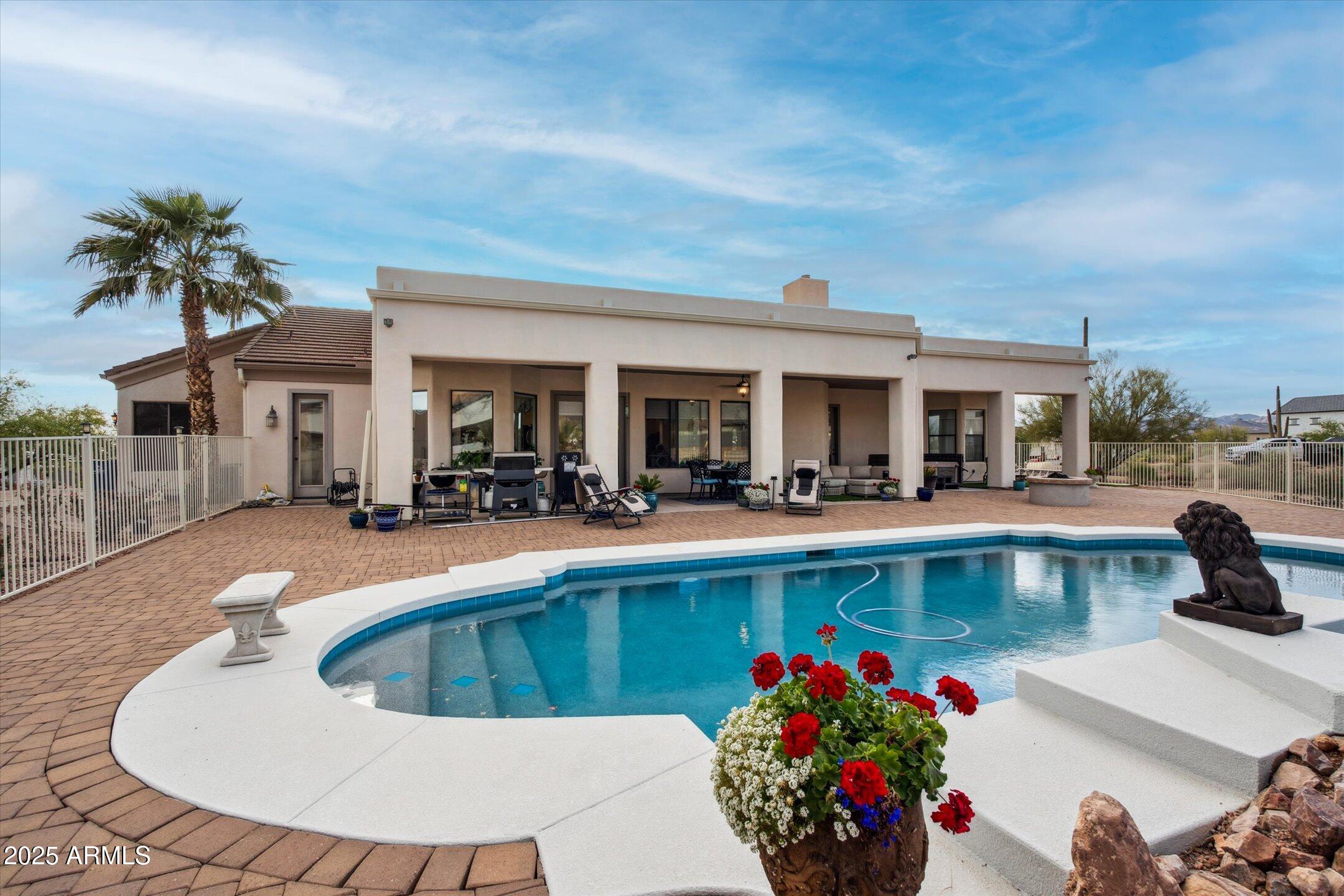 619 North Sun Road Apache Junction, AZ 85119 - Photo 56 of 72 a view of a swimming pool with outdoor seating