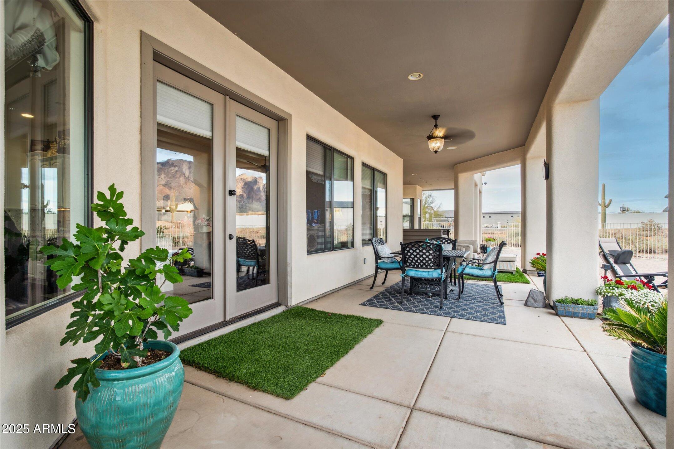 619 North Sun Road Apache Junction, AZ 85119 - Photo 57 of 72 a living room filled with furniture and a potted plant