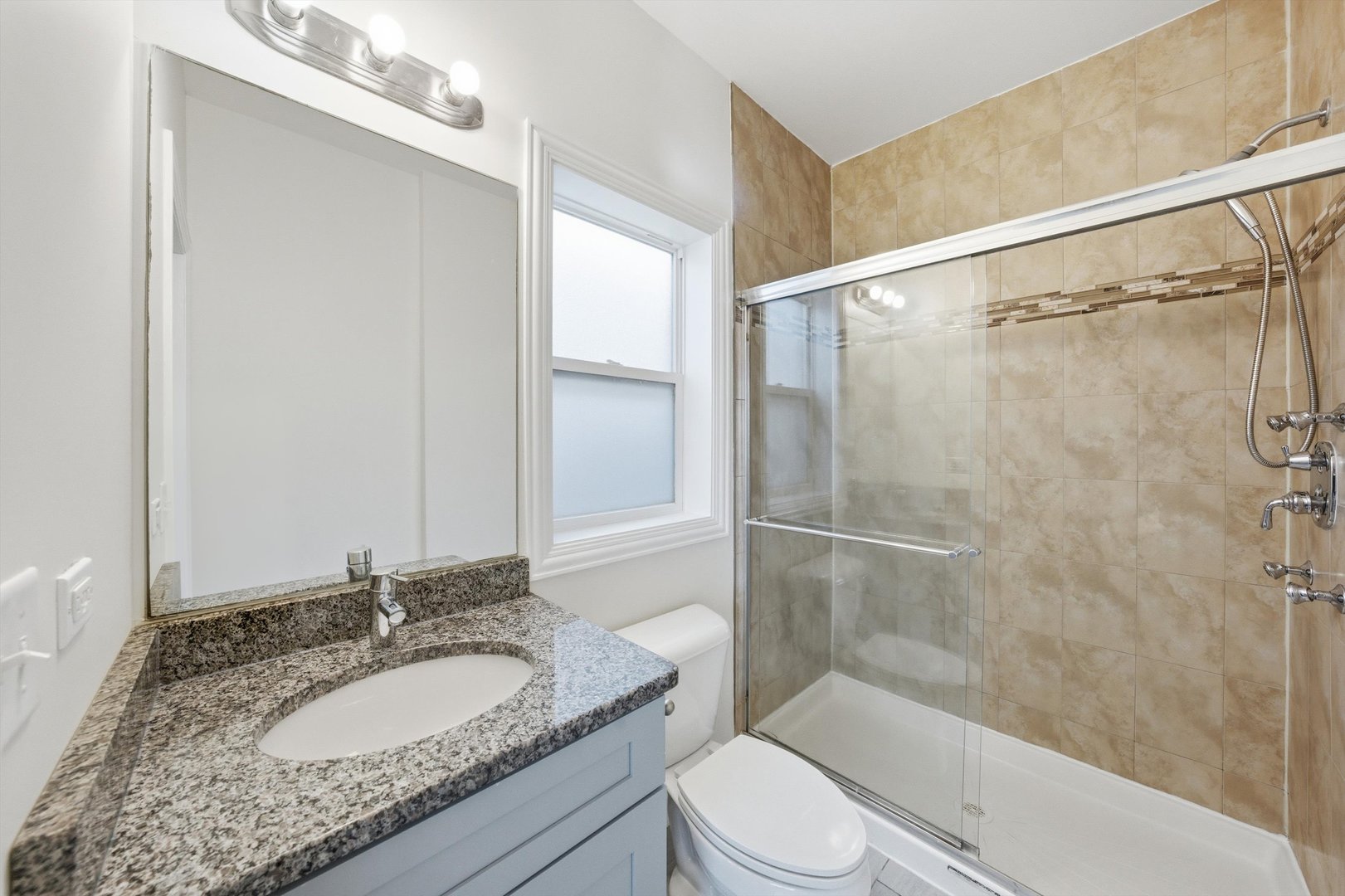 4063 South Rockwell Street Chicago, IL 60632 - Photo 13 of 24 a bathroom with a granite countertop sink toilet and shower