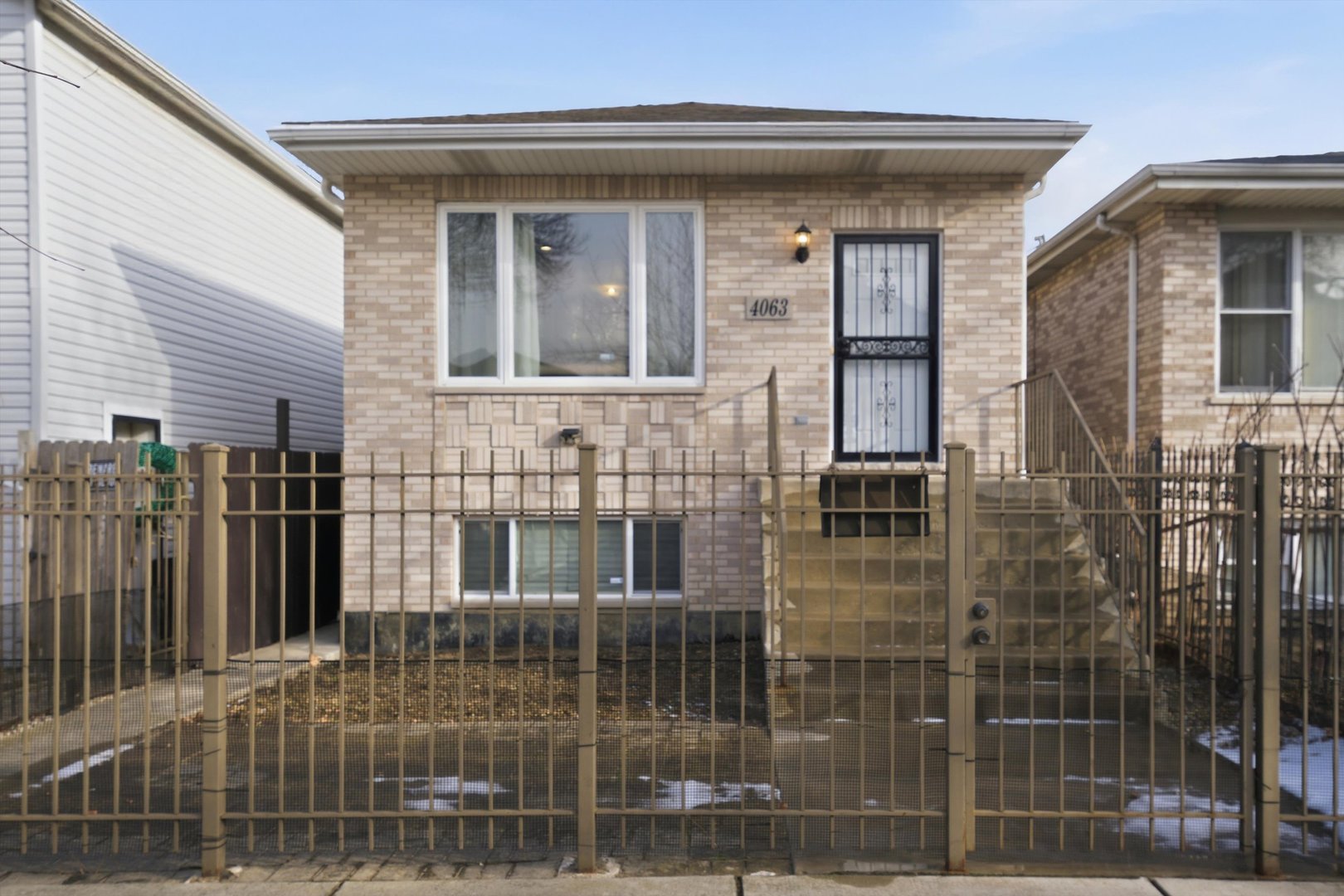 4063 South Rockwell Street Chicago, IL 60632 - Photo 3 of 24 a view of a brick house with a glass door