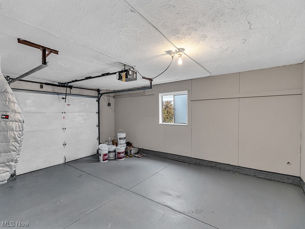 1661 Rush Road Wickliffe, OH 44092 - Photo 24 of 26 Garage with a garage door opener
