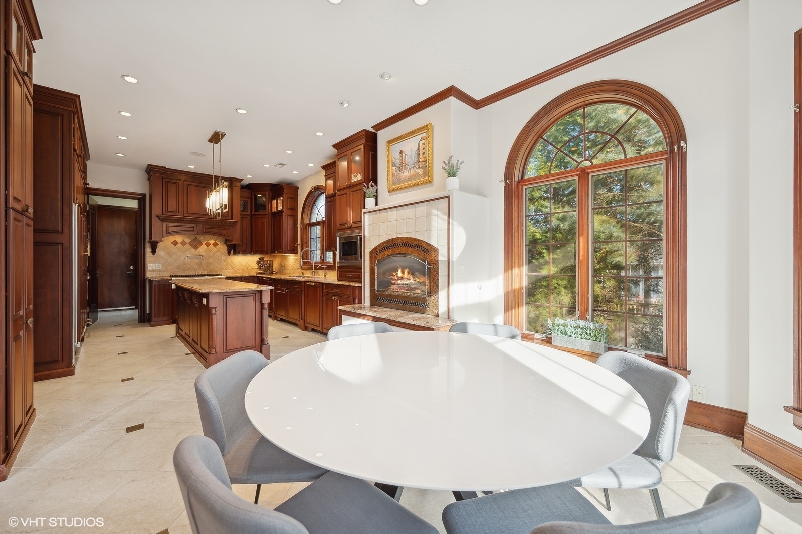 3235 Techny Road Northbrook, IL 60062 - Photo 12 of 45 a living room with stainless steel appliances furniture a fireplace and dining table