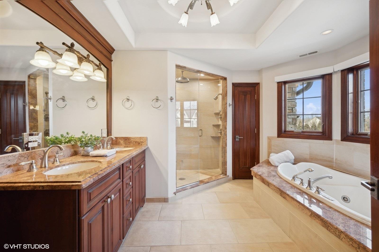 3235 Techny Road Northbrook, IL 60062 - Photo 24 of 45 a spacious bathroom with a granite countertop tub sink a mirror a shower and vanity