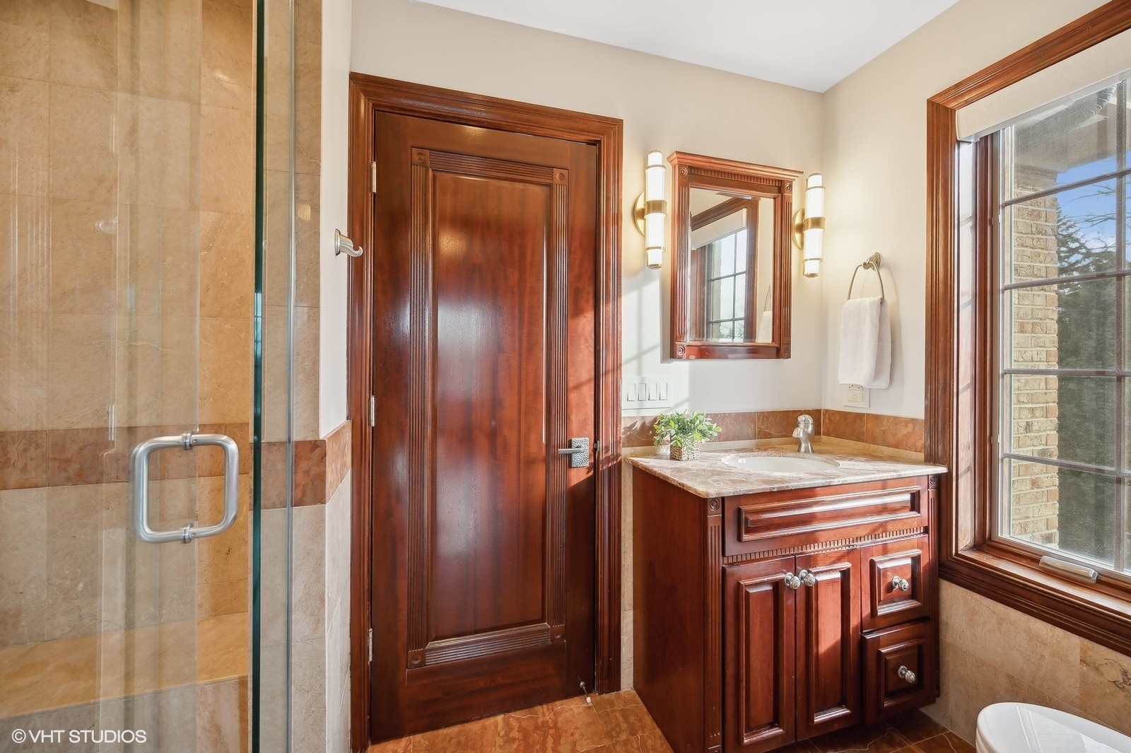 3235 Techny Road Northbrook, IL 60062 - Photo 27 of 45 a bathroom with a granite countertop shower a mirror and a sink