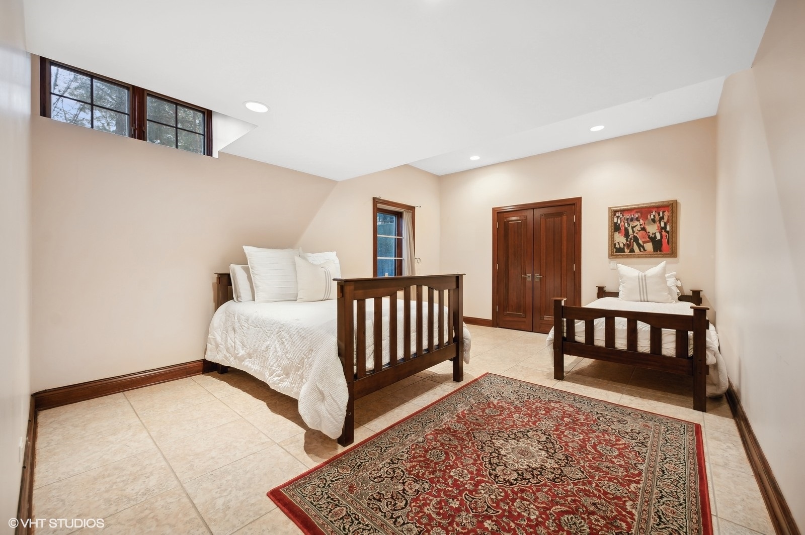 3235 Techny Road Northbrook, IL 60062 - Photo 37 of 45 a bedroom with a bed and paintings on the wall