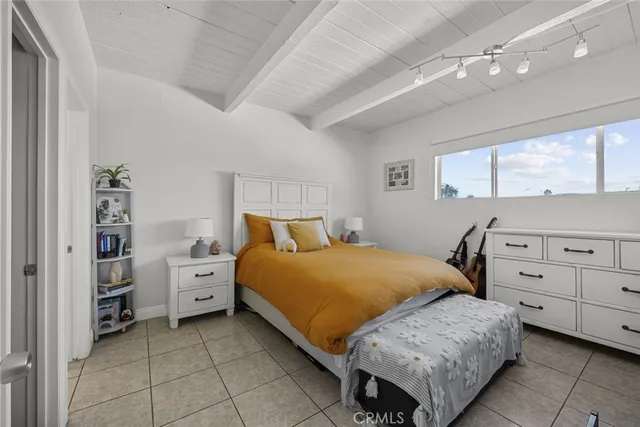 a bedroom with a bed and a cabinets