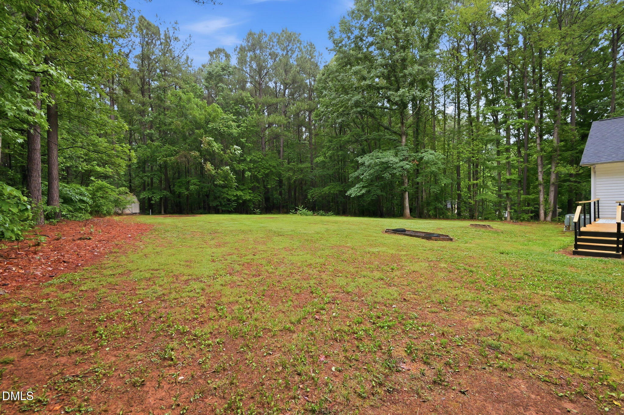 1925 Old Allensville Road Roxboro, NC 27574 - Photo 20 of 58 a view of a field with trees in the background