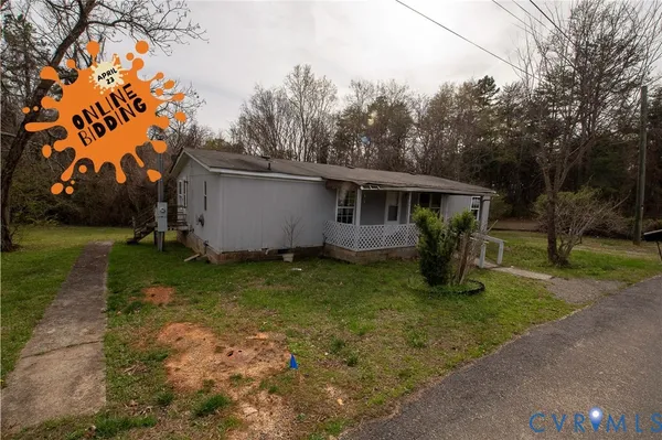 a view of a barn in the middle of a yard