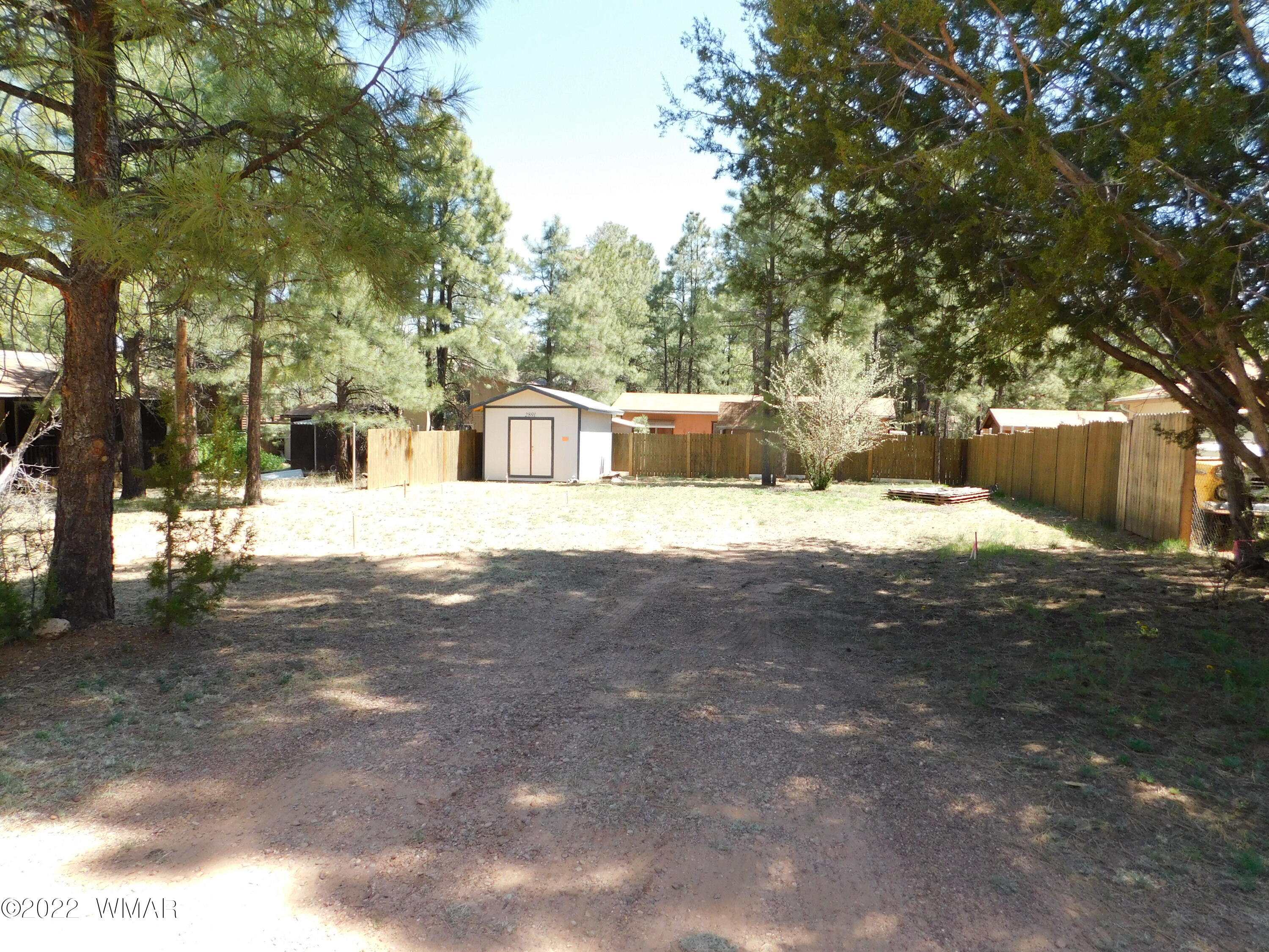 2891 Big Pine Road Overgaard, AZ 85933 - Photo 1 of 4 a view of a house with a yard