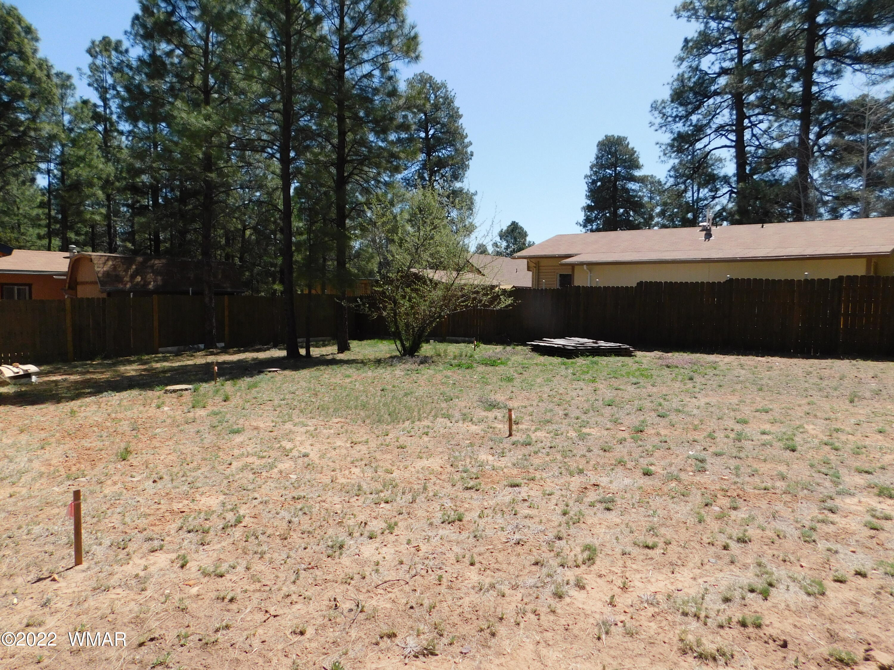 2891 Big Pine Road Overgaard, AZ 85933 - Photo 4 of 4 a view of backyard with wooden fence