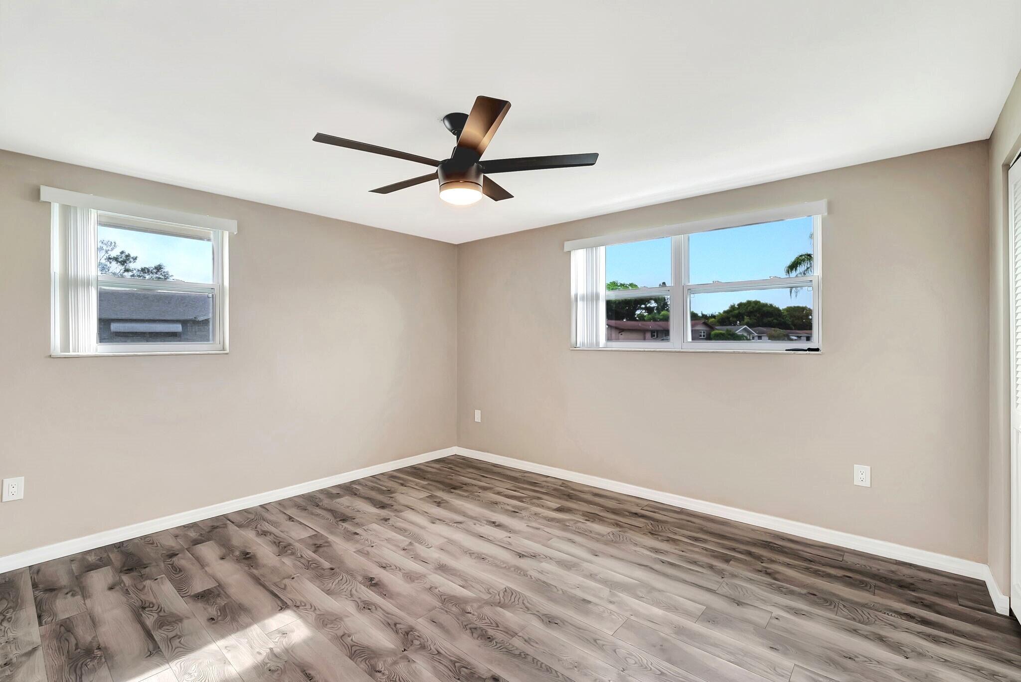 7611 Spirea Drive Port Richey, FL 34668 - Photo 15 of 31 Primary Bedroom