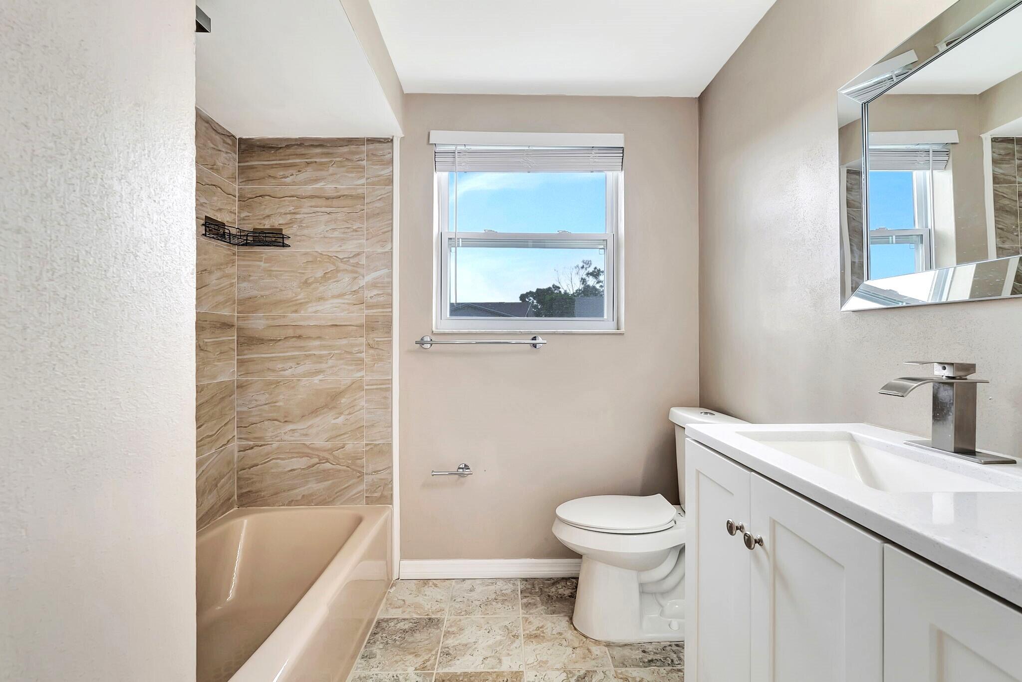 7611 Spirea Drive Port Richey, FL 34668 - Photo 20 of 31 Shower Tub Combo Bathroom 2