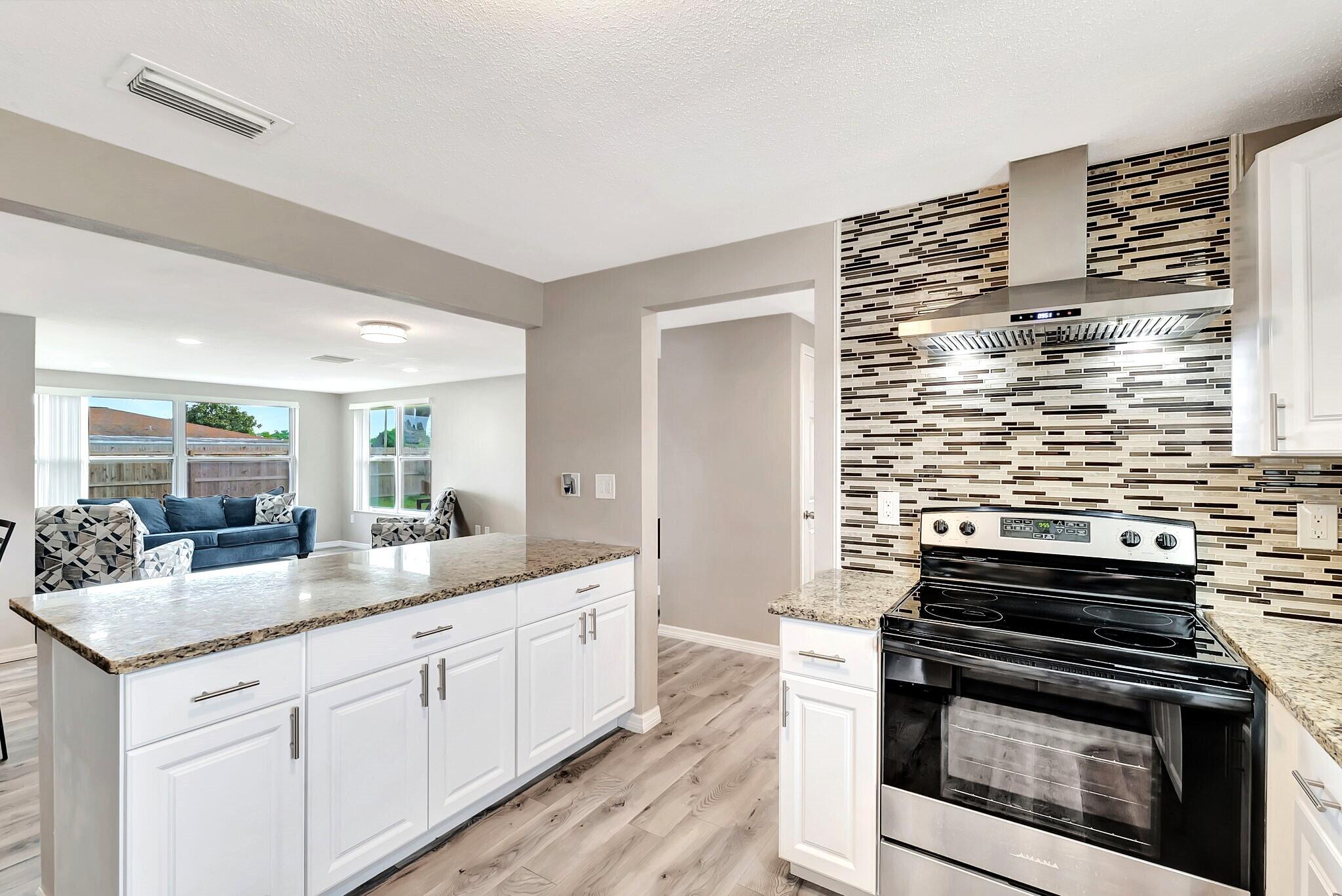 7611 Spirea Drive Port Richey, FL 34668 - Photo 8 of 31 Range Hood Ventilation