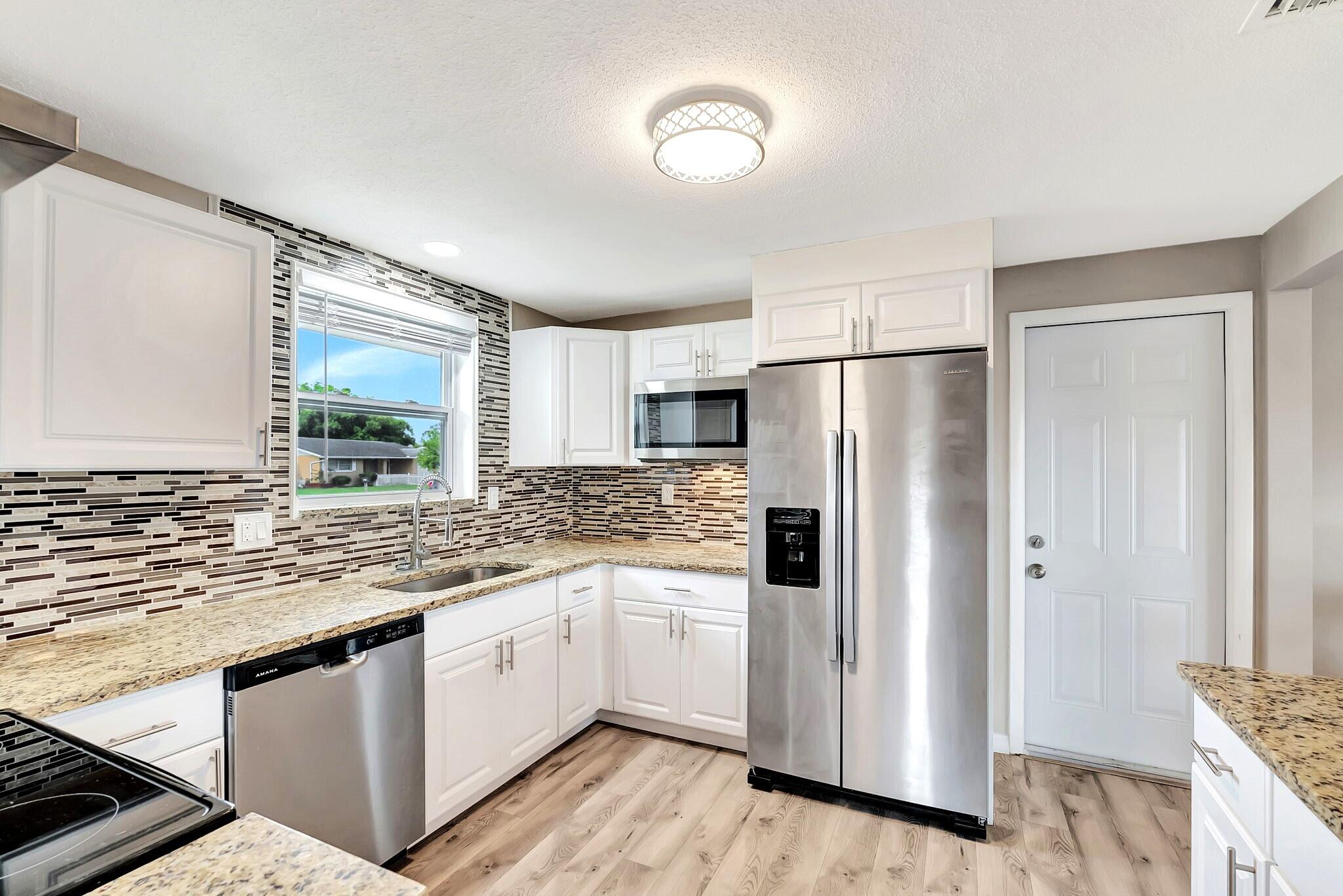 7611 Spirea Drive Port Richey, FL 34668 - Photo 9 of 31 Kitchen Area