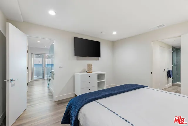 a view of residential houses with snow on the road