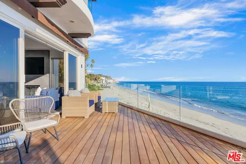 a view of swimming pool with seating space