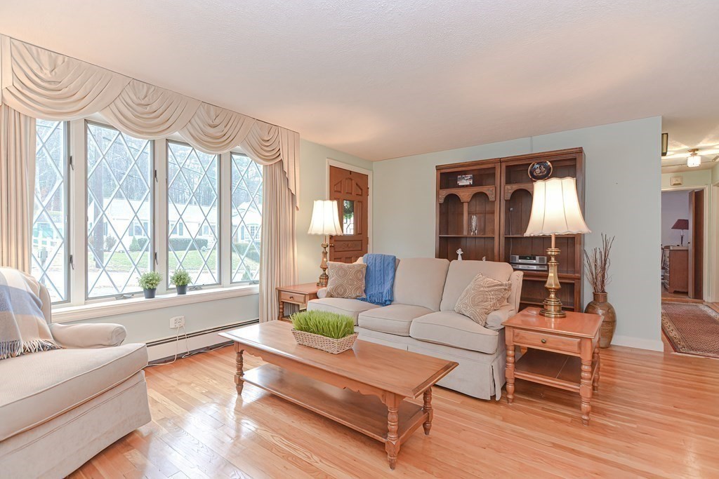 22 Grace Road Woburn, MA 01801 - Photo 15 of 36 a living room with furniture and a large window