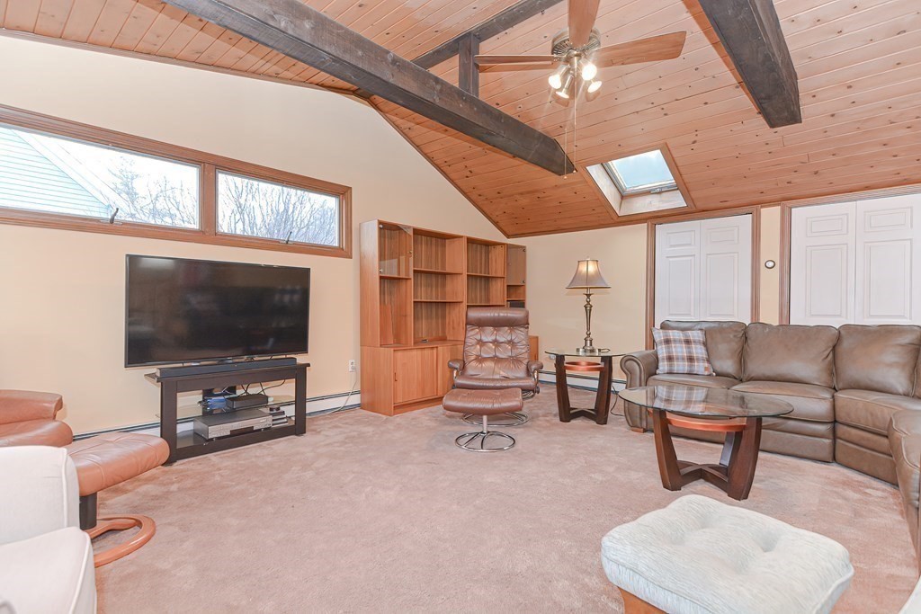 22 Grace Road Woburn, MA 01801 - Photo 19 of 36 a living room with furniture and a flat screen tv