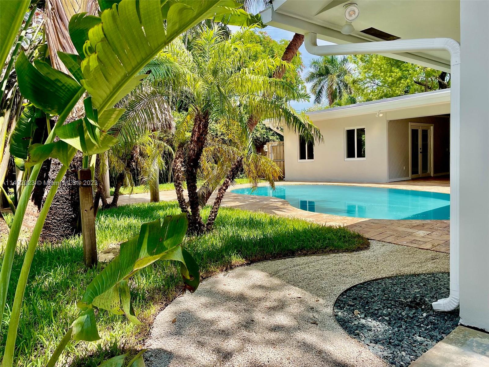 5110 Tyler Street Hollywood, FL 33021 - Photo 2 of 2 a front view of a house with garden