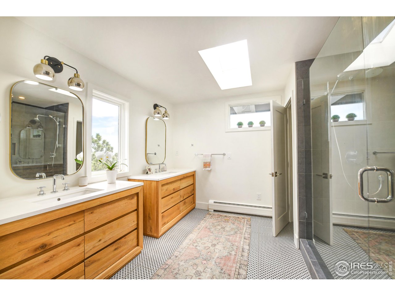 252 Pine Tree Lane Boulder, CO 80304 - Photo 20 of 39 a bathroom with a double vanity sink mirror and bathtub