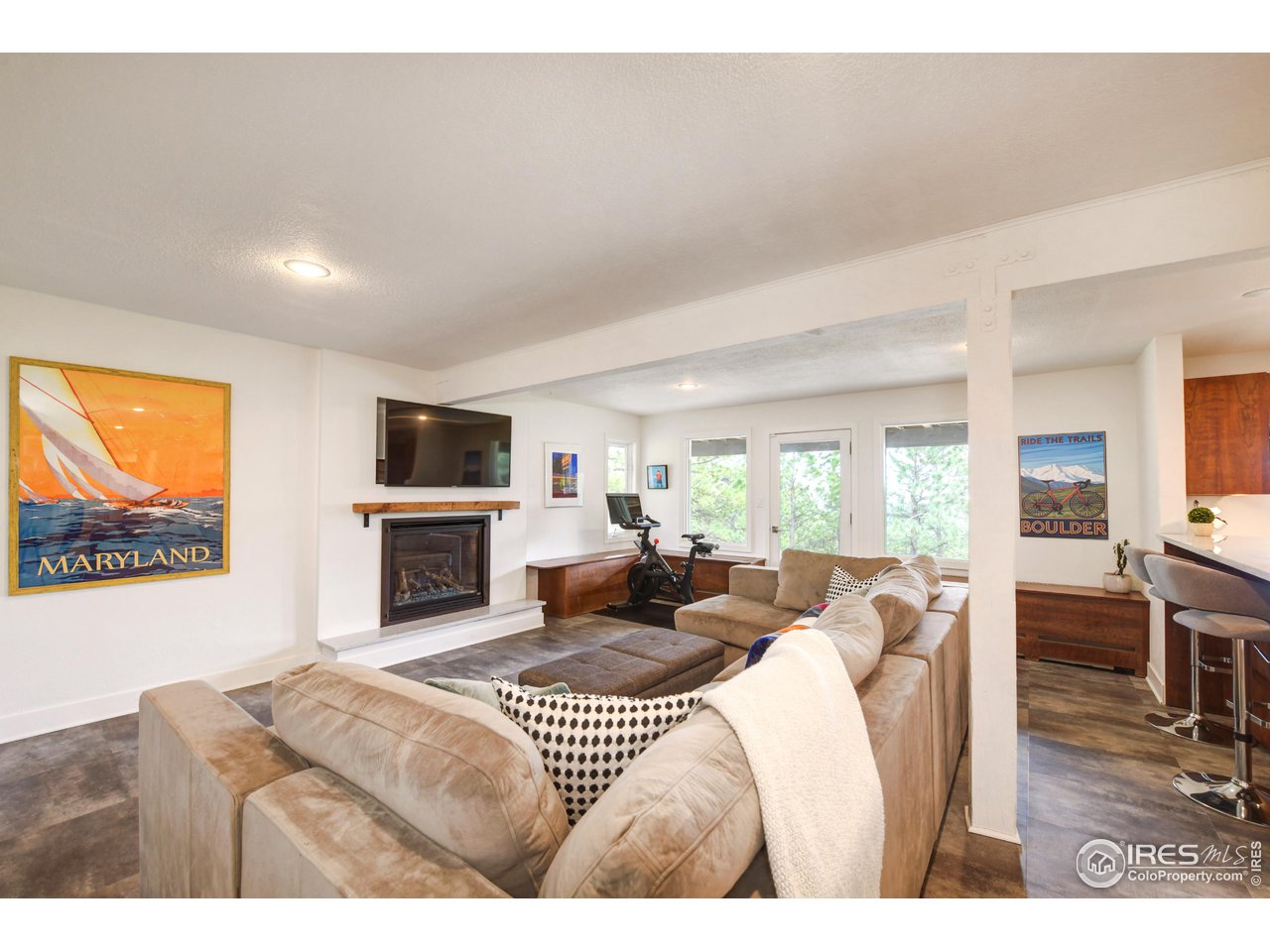 252 Pine Tree Lane Boulder, CO 80304 - Photo 23 of 39 a living room with furniture a fireplace and a flat screen tv