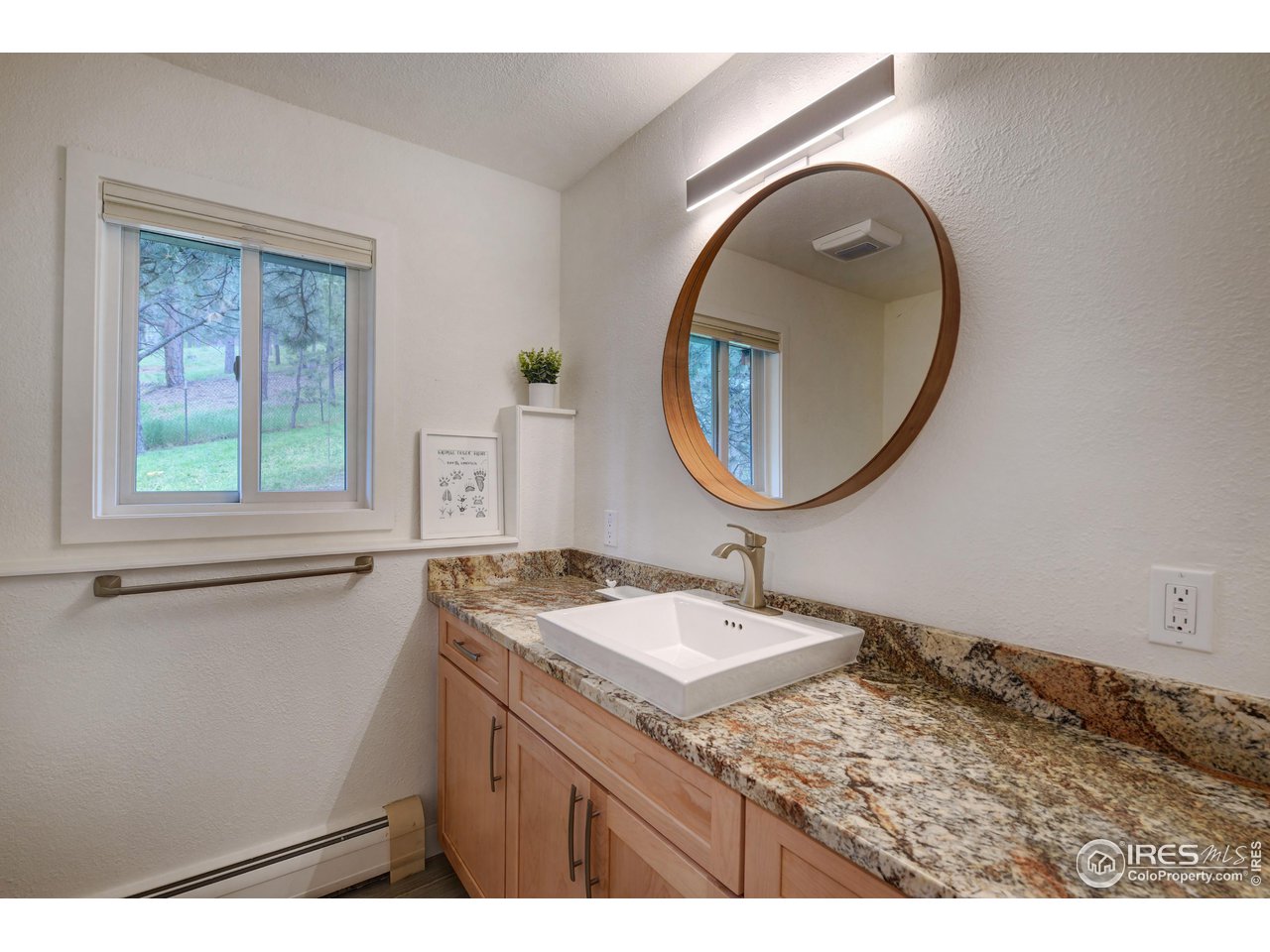 252 Pine Tree Lane Boulder, CO 80304 - Photo 26 of 39 a bathroom with a sink and a mirror