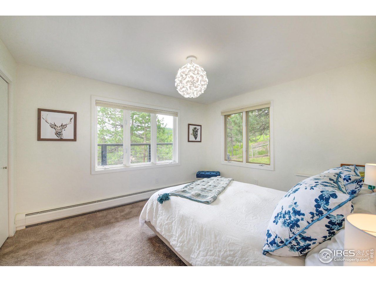 252 Pine Tree Lane Boulder, CO 80304 - Photo 27 of 39 a bedroom with a bed and a window