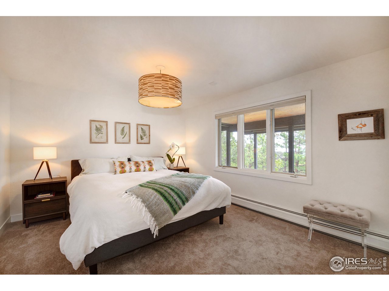 252 Pine Tree Lane Boulder, CO 80304 - Photo 28 of 39 a bedroom with a bed and a lamp