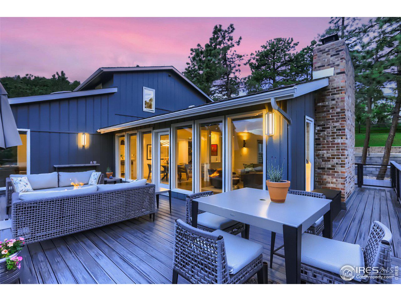252 Pine Tree Lane Boulder, CO 80304 - Photo 34 of 39 a view of a house with a patio and a yard