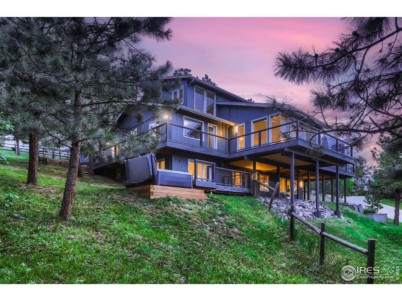 252 Pine Tree Lane Boulder, CO 80304 - Photo 35 of 39 a view of a big house with a big yard and large trees