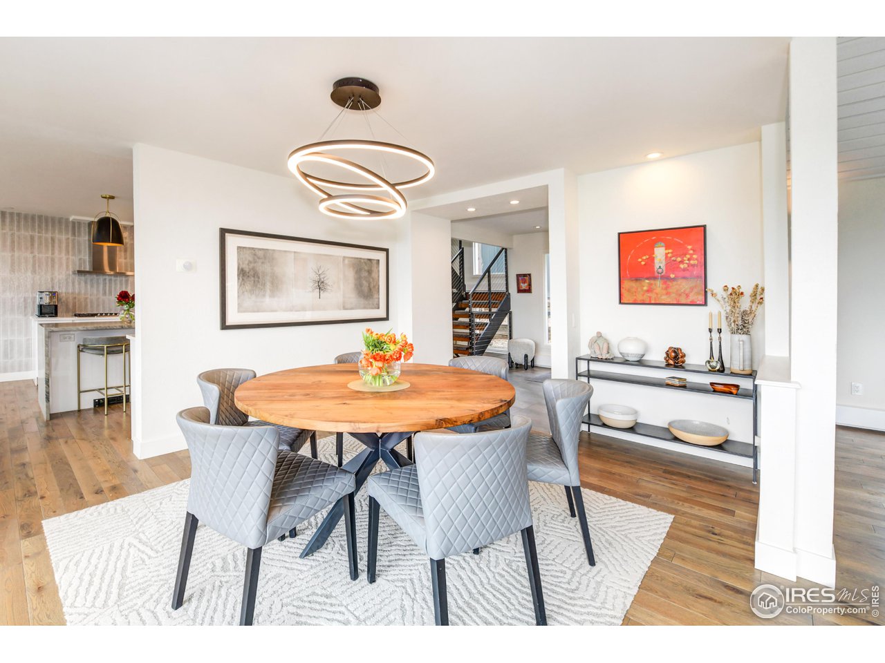252 Pine Tree Lane Boulder, CO 80304 - Photo 4 of 39 a view of a dining room with furniture and wooden floor