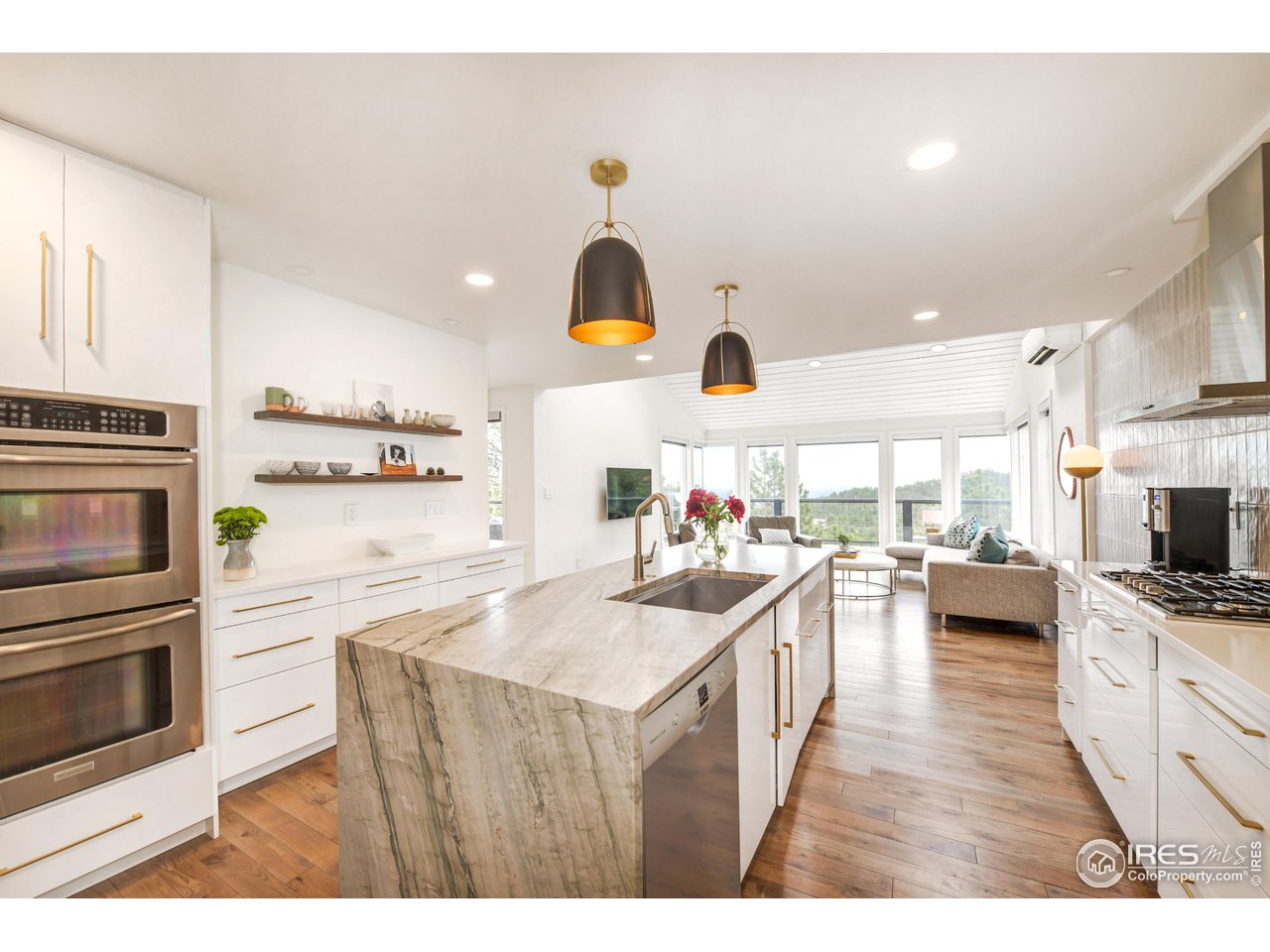 252 Pine Tree Lane Boulder, CO 80304 - Photo 7 of 39 a kitchen with stainless steel appliances kitchen island granite countertop a stove a sink and a refrigerator