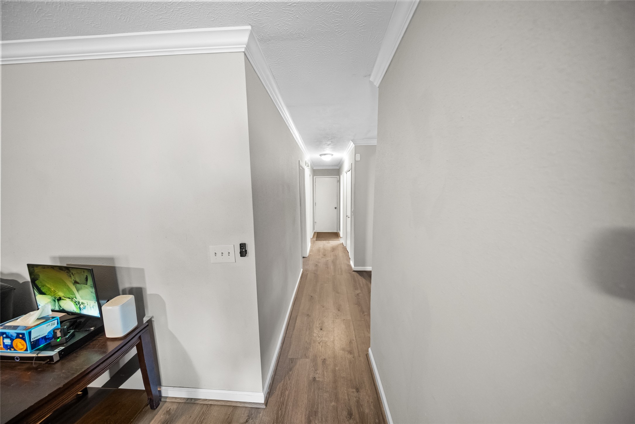 9107 Towerstone Court Spring, TX 77379 - Photo 29 of 42 Hallway from family room to the second and third bedrooms.