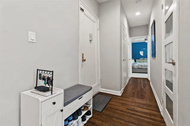 a view of a hallway view with wooden floor and staircase
