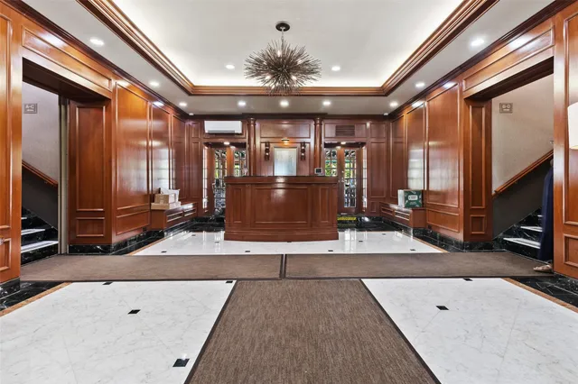 a view of living room kitchen with furniture and flat screen tv