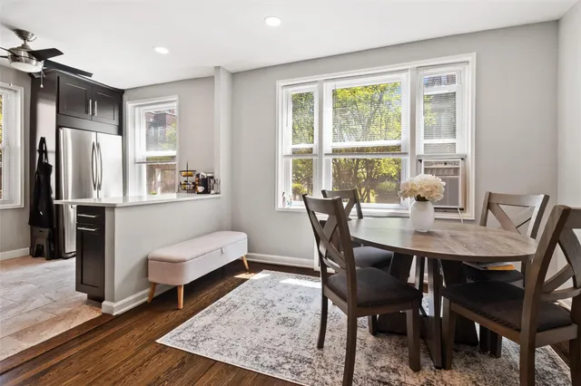 a view of a dining room with furniture window and wooden floor