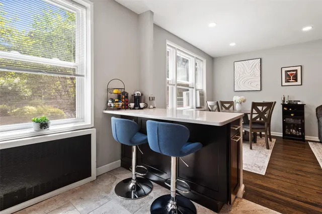 a view of a dining room with furniture and window