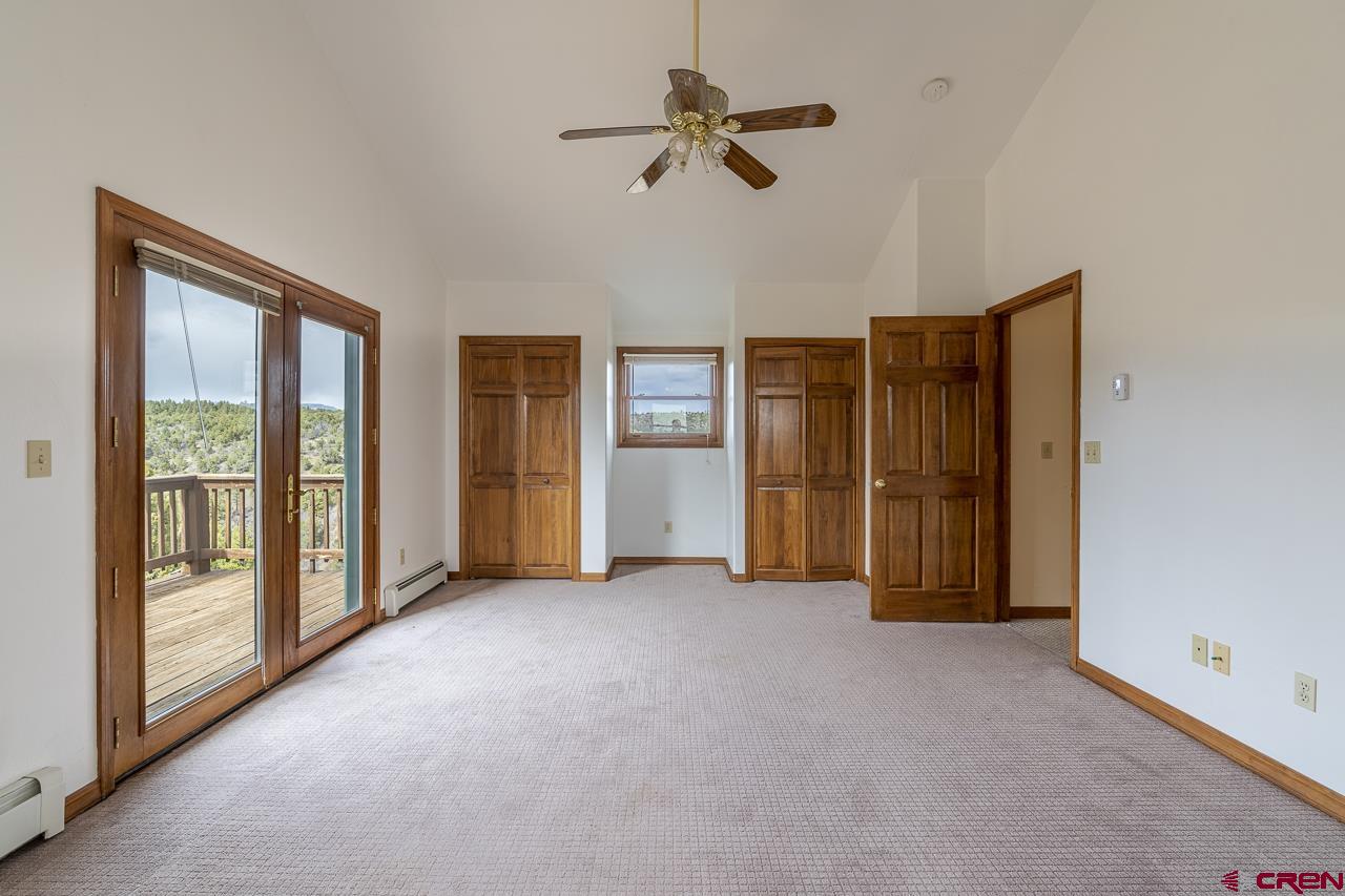 1403 Skyview Road Bayfield, CO 81122 - Photo 16 of 35 a view of empty room with ceiling fan
