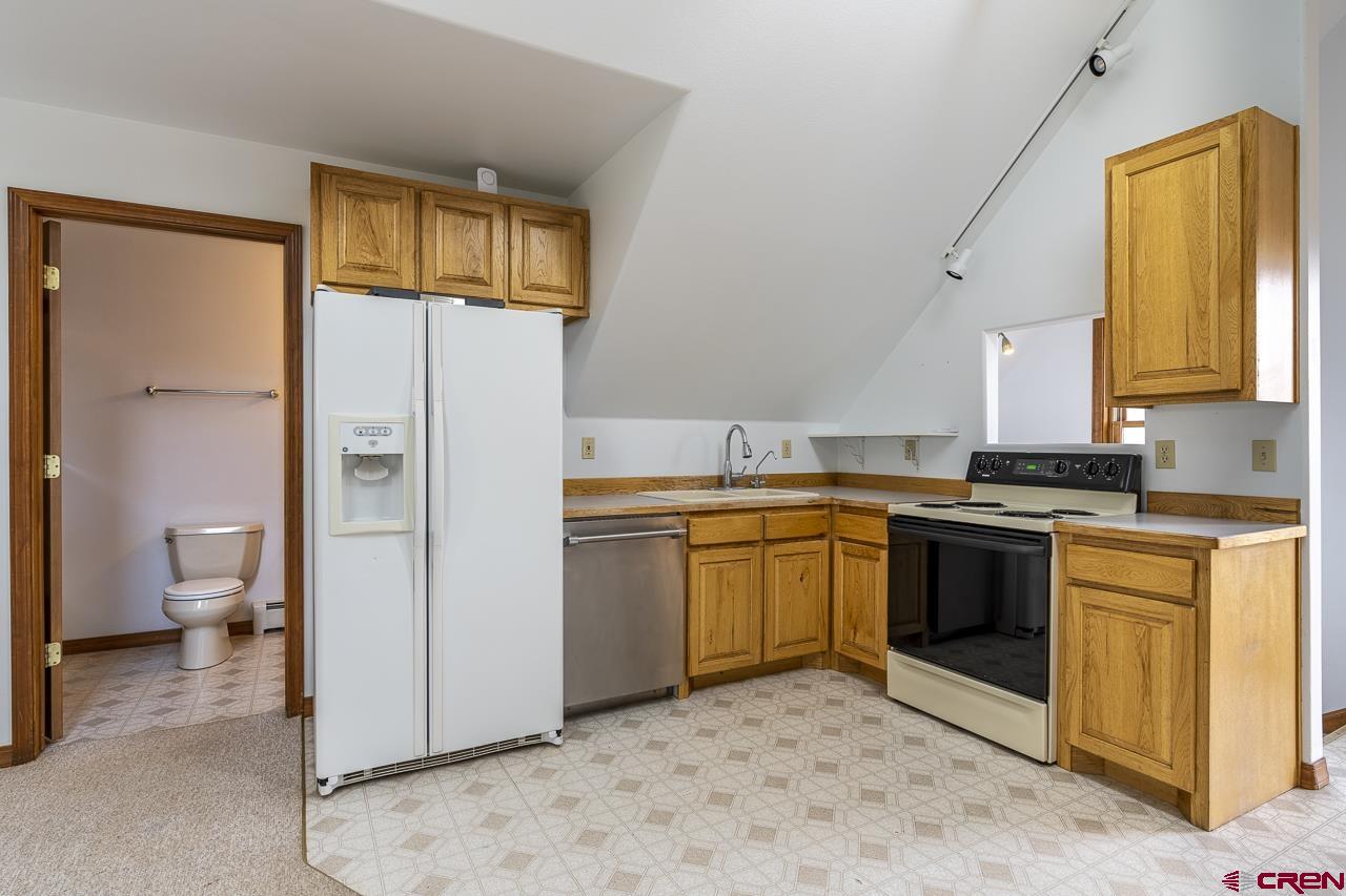 1403 Skyview Road Bayfield, CO 81122 - Photo 17 of 35 a kitchen with a refrigerator sink and stove