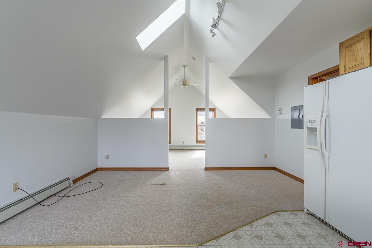 1403 Skyview Road Bayfield, CO 81122 - Photo 19 of 35 an empty room with a windows and ceiling fan