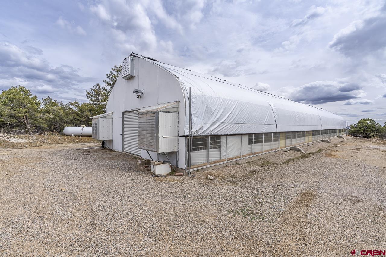 1403 Skyview Road Bayfield, CO 81122 - Photo 22 of 35 a view of a house with a yard