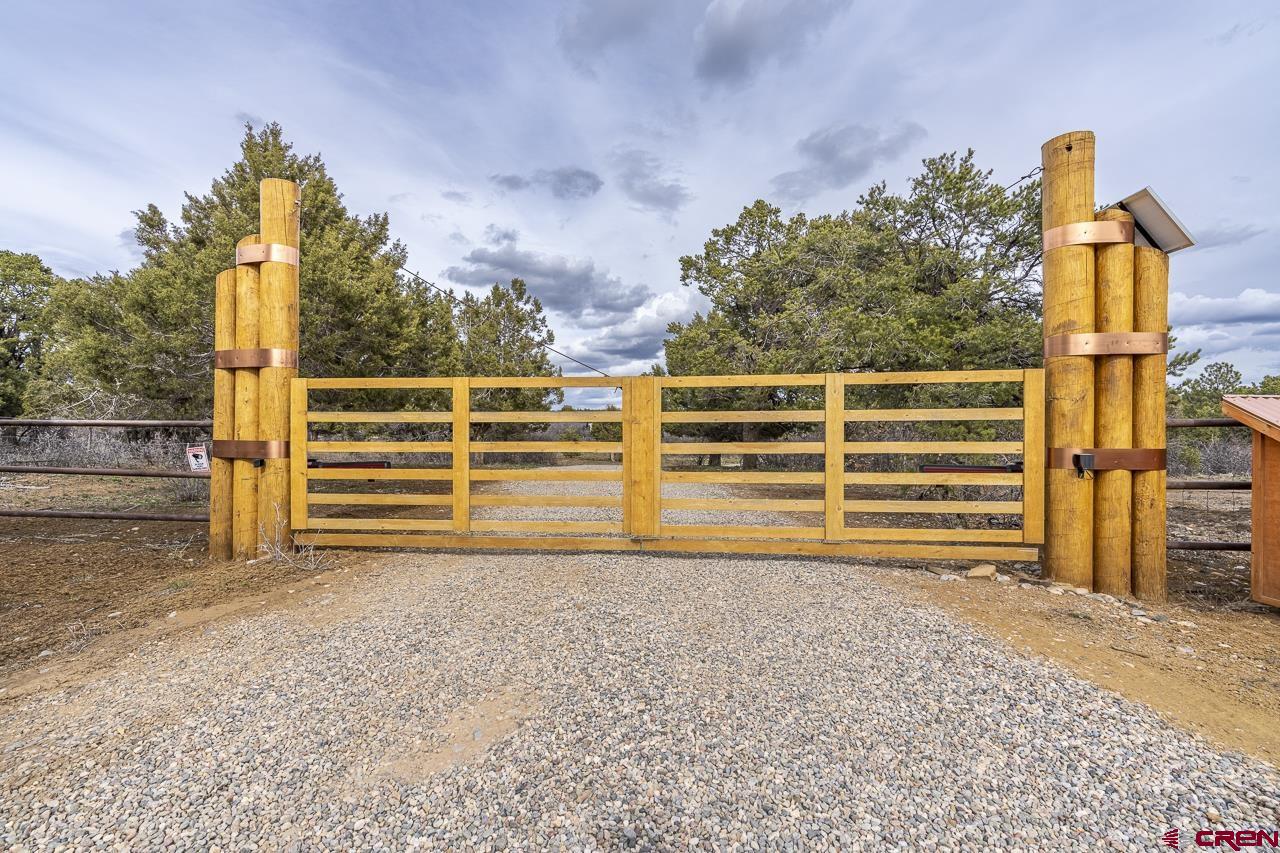 1403 Skyview Road Bayfield, CO 81122 - Photo 31 of 35 a view of a house with backyard and garage