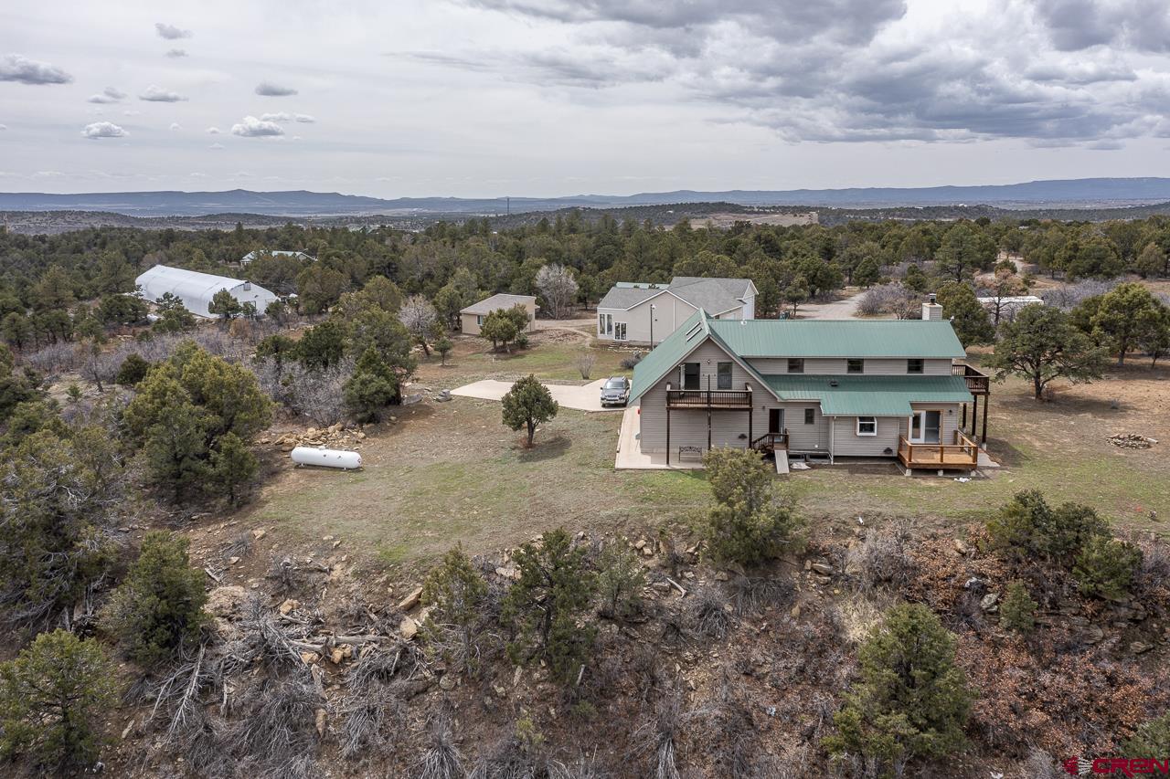 1403 Skyview Road Bayfield, CO 81122 - Photo 32 of 35 an aerial view of a house with a yard and lake view