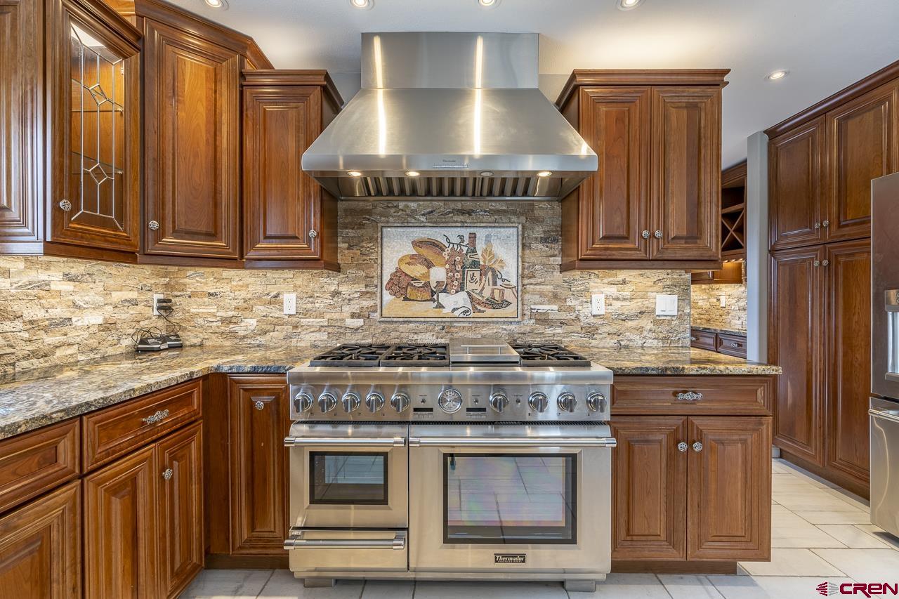 1403 Skyview Road Bayfield, CO 81122 - Photo 6 of 35 a stove top oven sitting inside of a kitchen