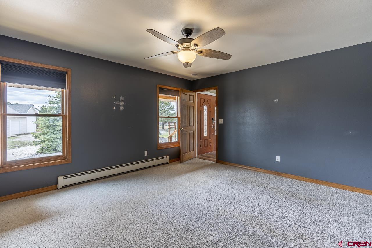 1403 Skyview Road Bayfield, CO 81122 - Photo 8 of 35 a view of a livingroom with a ceiling fan and window